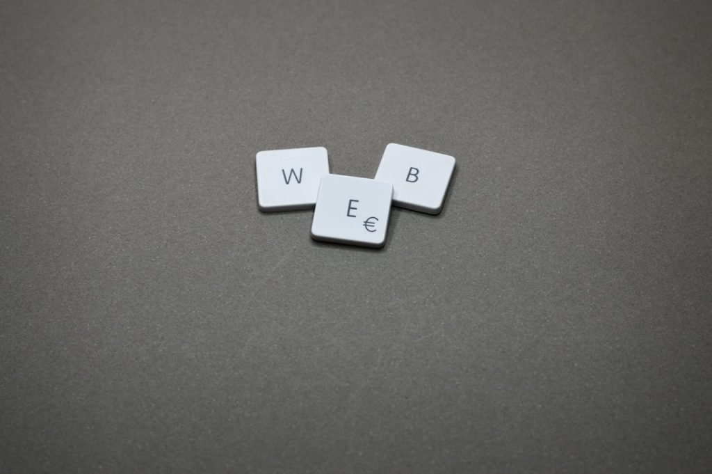 Minimalist image of keyboard keys spelling WEB on a plain background.